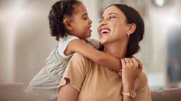 Foster carer smiling at a foster child