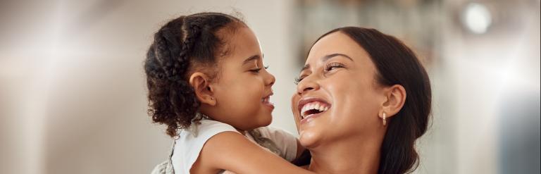 Foster carer smiling at a foster child